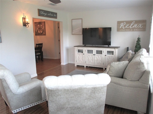 living room with dark hardwood / wood-style floors