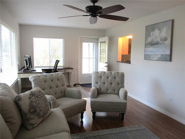 living room with hardwood / wood-style floors, plenty of natural light, and ceiling fan