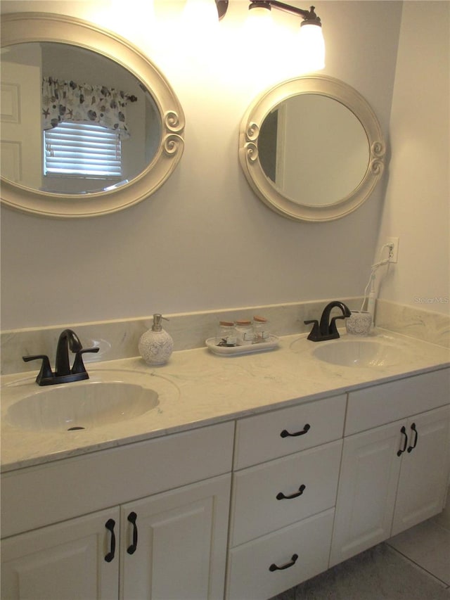 bathroom featuring tile patterned floors and vanity