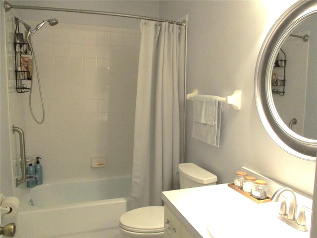 full bathroom featuring vanity, shower / bath combination with curtain, and toilet