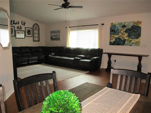 living room featuring hardwood / wood-style flooring, ceiling fan, and lofted ceiling