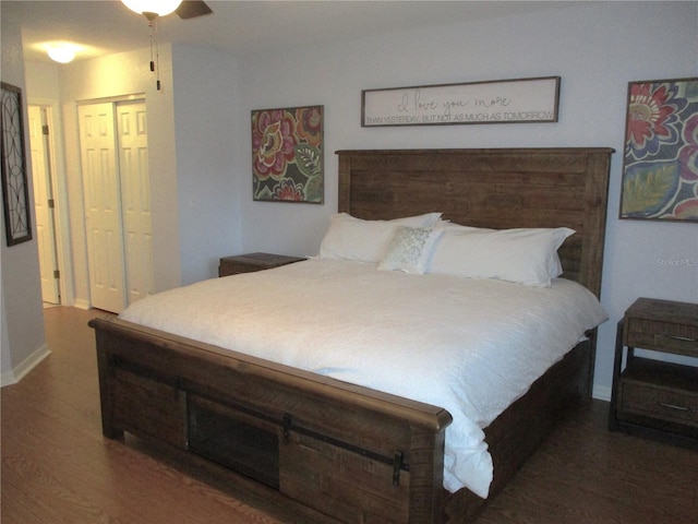 bedroom featuring a closet, dark hardwood / wood-style floors, and ceiling fan