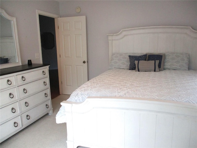 bedroom with light colored carpet