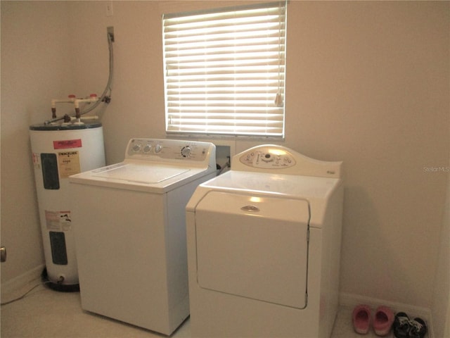 washroom featuring washer and dryer and electric water heater