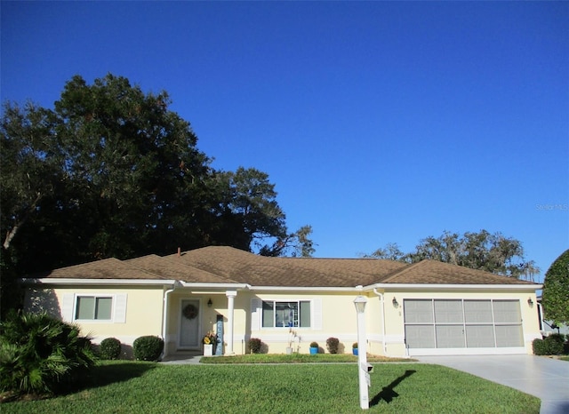 ranch-style house with a front lawn and a garage