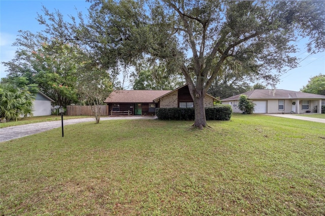 single story home with a front yard