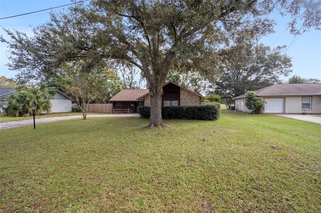 single story home with a garage and a front yard