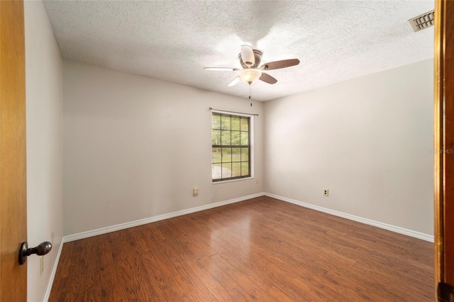 unfurnished room with hardwood / wood-style floors, ceiling fan, and a textured ceiling