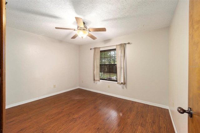 unfurnished room with a textured ceiling, dark hardwood / wood-style floors, and ceiling fan