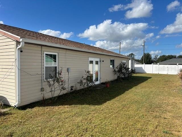 rear view of house with a lawn