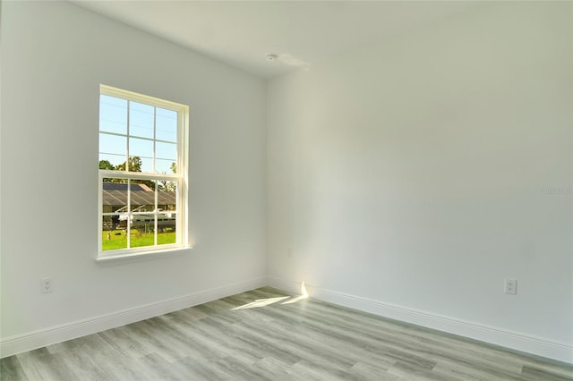 spare room featuring light wood-type flooring