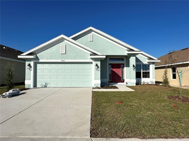 ranch-style house with a front yard and a garage