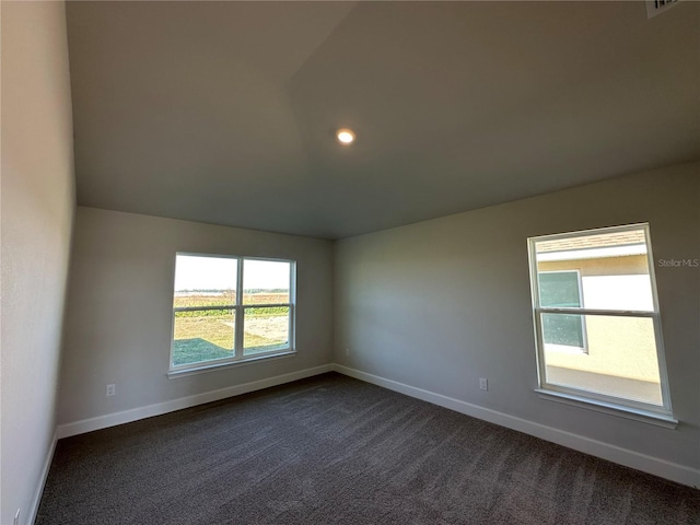4489 SW 90th Pl, Ocala, FL 34476 - empty room featuring dark colored carpet, baseboards, lofted ceiling, and recessed lighting