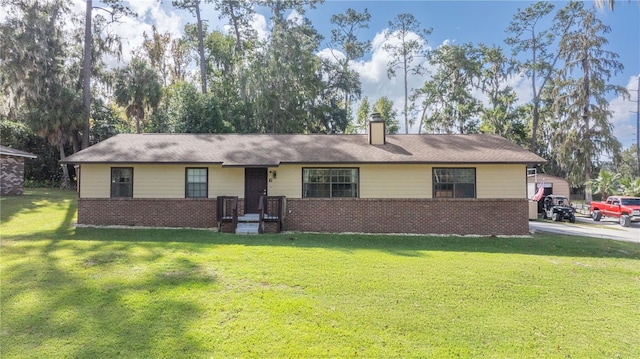 ranch-style home featuring a front yard