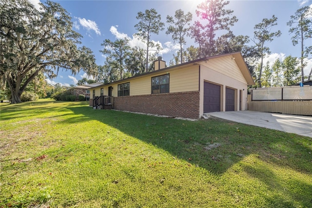 view of side of property with a lawn