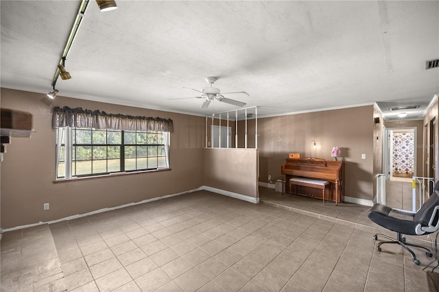 unfurnished room with light tile patterned flooring, ceiling fan, and crown molding