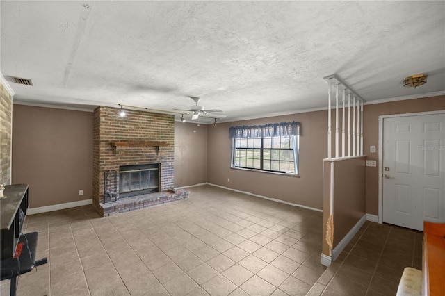 unfurnished living room featuring crown molding, a textured ceiling, light tile patterned floors, a brick fireplace, and ceiling fan