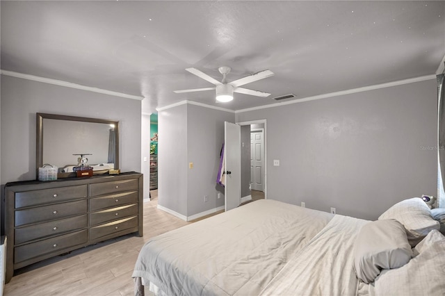 bedroom with light hardwood / wood-style floors, ceiling fan, and crown molding