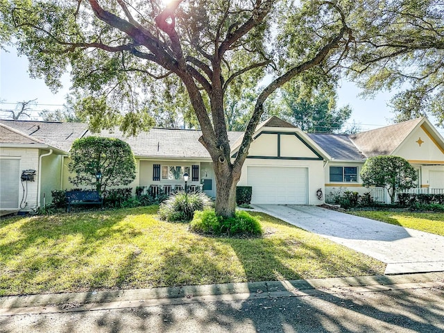 single story home featuring a garage and a front lawn