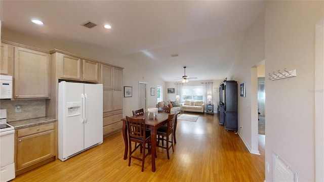 kitchen with white appliances, ceiling fan, light brown cabinetry, and light hardwood / wood-style floors