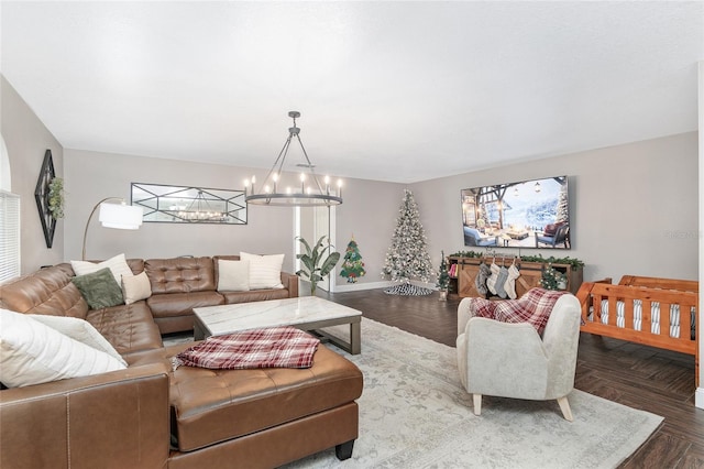 living room with a notable chandelier and parquet floors