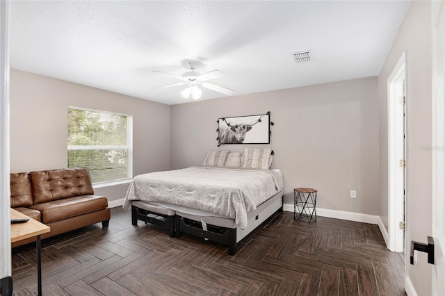 bedroom featuring dark parquet flooring and ceiling fan