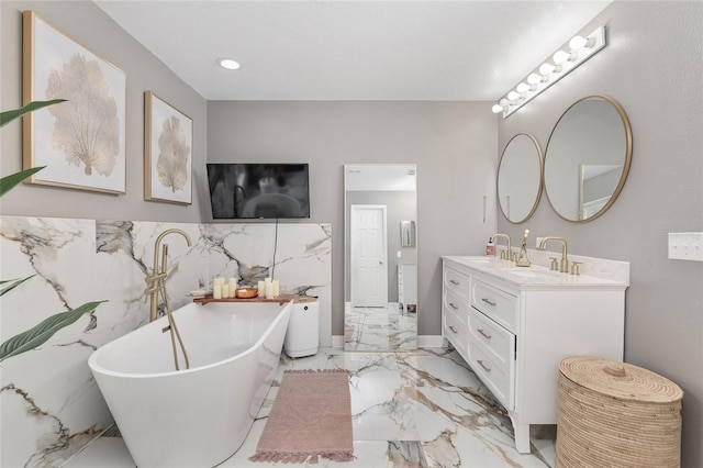 bathroom featuring vanity, tile walls, and a bathing tub