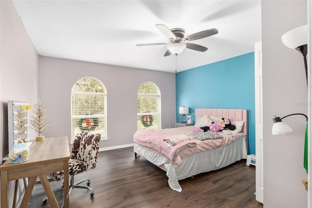 bedroom with ceiling fan and dark hardwood / wood-style floors