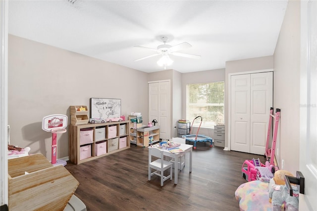 recreation room featuring dark hardwood / wood-style flooring and ceiling fan