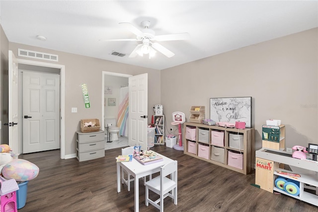 game room with ceiling fan and dark hardwood / wood-style floors