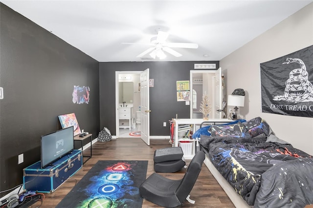 bedroom featuring ensuite bathroom, ceiling fan, and dark hardwood / wood-style floors