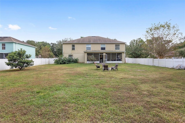 back of house featuring a yard