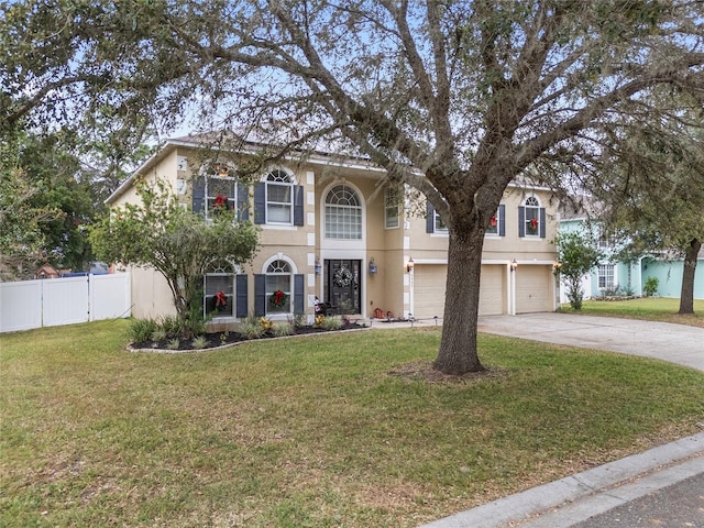 view of front of house with a garage and a front yard