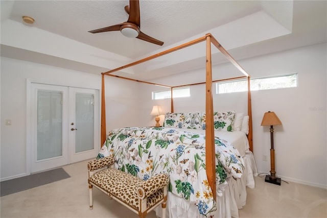 carpeted bedroom featuring ceiling fan, a closet, and french doors