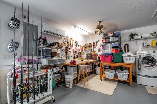 interior space with ceiling fan, washing machine and dryer, and a wall mounted AC