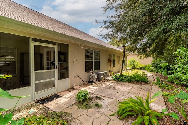 view of patio with a sunroom