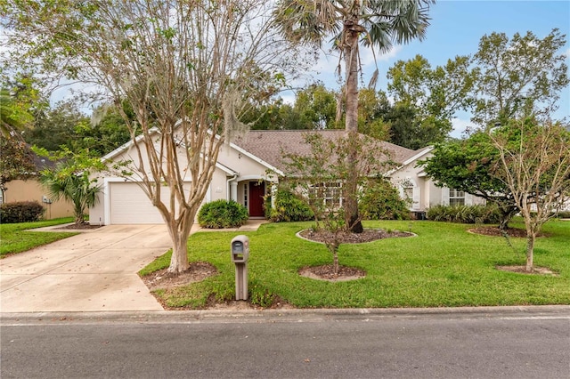 view of front facade with a front yard and a garage