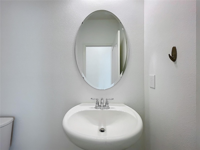 bathroom with toilet and sink