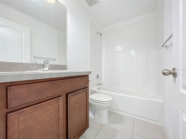 full bathroom with tile patterned floors, tiled shower / bath, vanity, and toilet