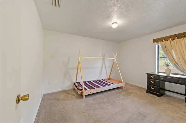 bedroom featuring visible vents, carpet floors, and baseboards