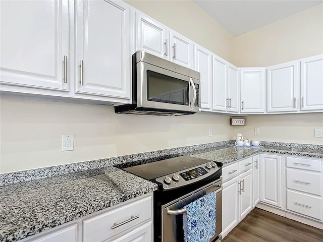 kitchen with stainless steel appliances and white cabinetry