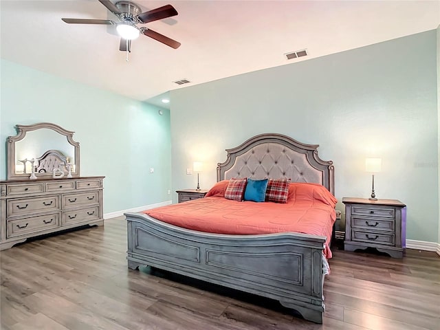 bedroom with ceiling fan and dark hardwood / wood-style floors