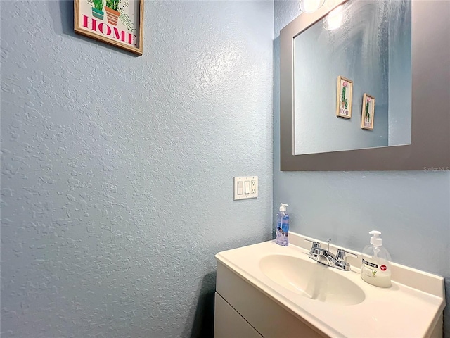 227 Locust Pass Crse, Ocala, FL 34472 - bathroom featuring a textured wall and vanity
