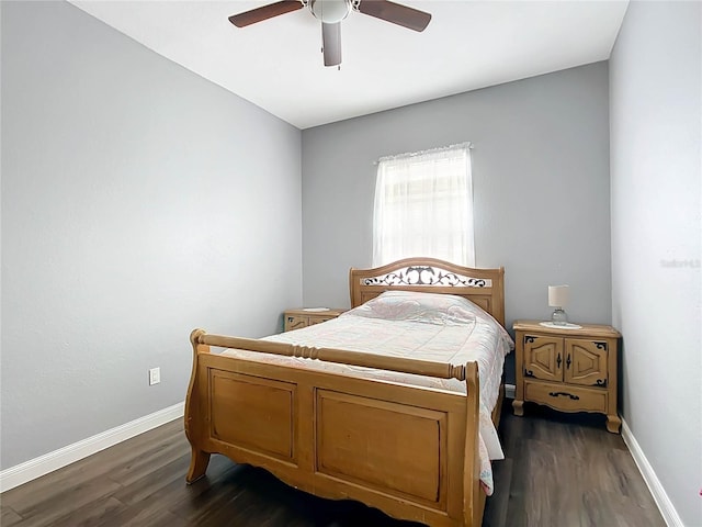 bedroom with ceiling fan and dark hardwood / wood-style floors