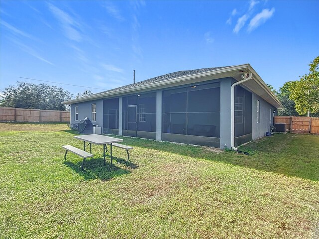 227 Locust Pass Crse, Ocala, FL 34472 - back of property featuring a sunroom and stucco siding