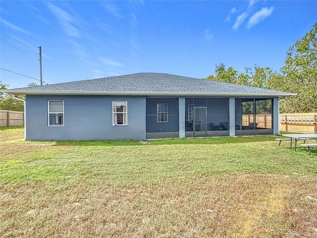227 Locust Pass Crse, Ocala, FL 34472 - rear view of house featuring a sunroom, stucco siding, and a shingled roof
