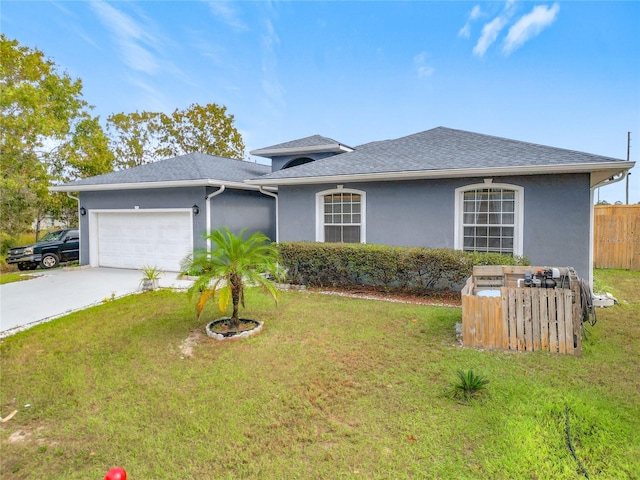 ranch-style home featuring a front lawn and a garage