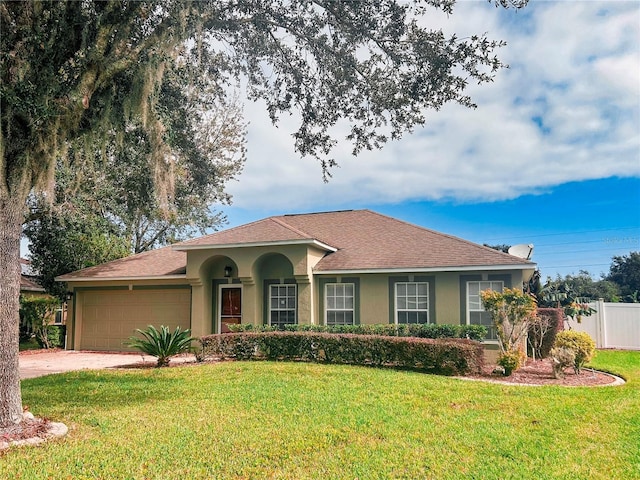 view of front facade with a garage and a front yard