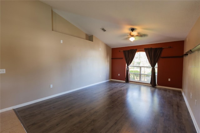 unfurnished room featuring dark wood-type flooring, lofted ceiling, and ceiling fan