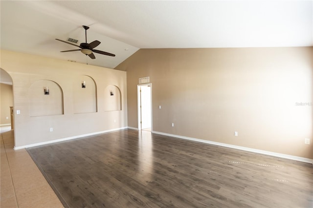 unfurnished living room featuring dark wood-type flooring, lofted ceiling, and ceiling fan